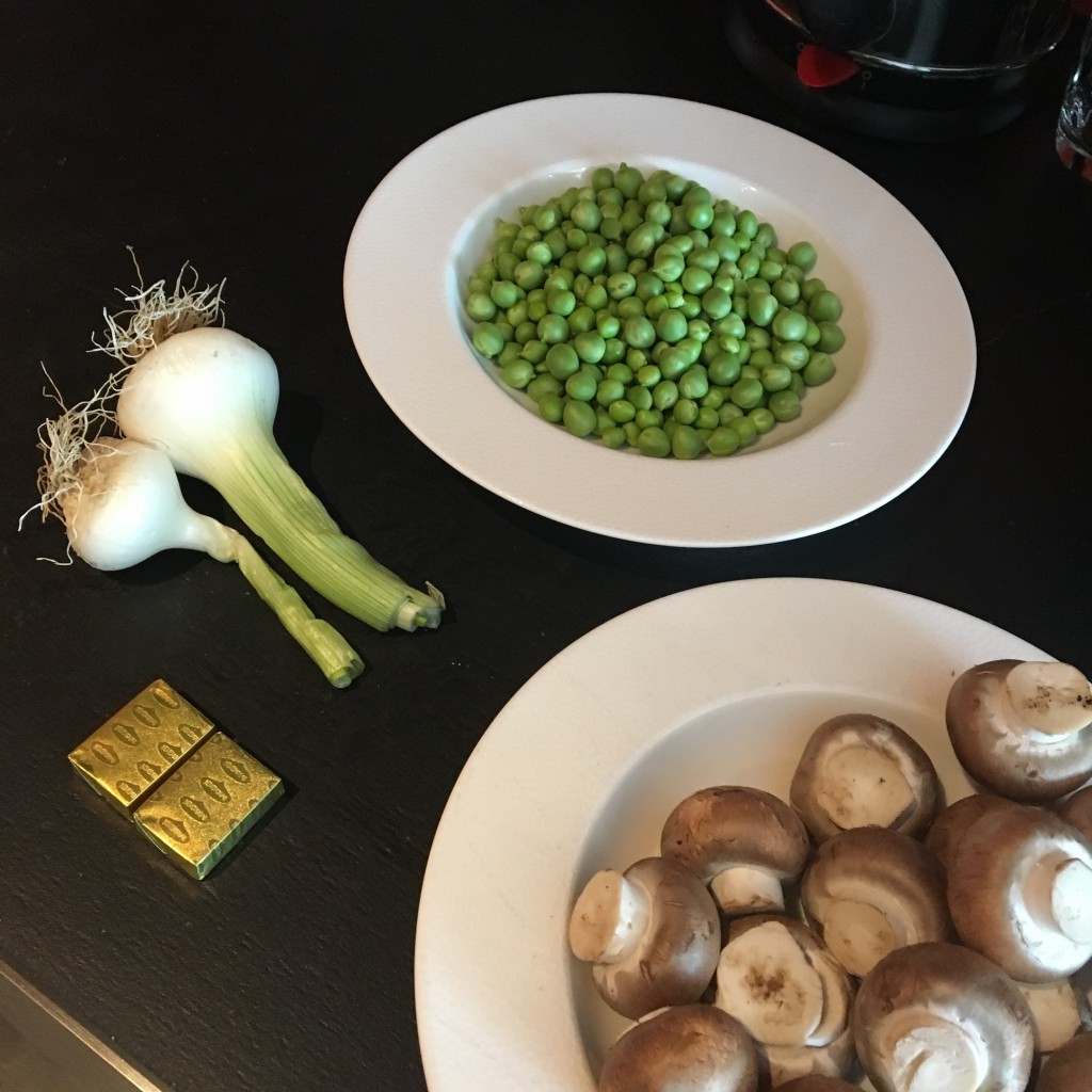Chicken soup with mushrooms, garden peas, spring onion
